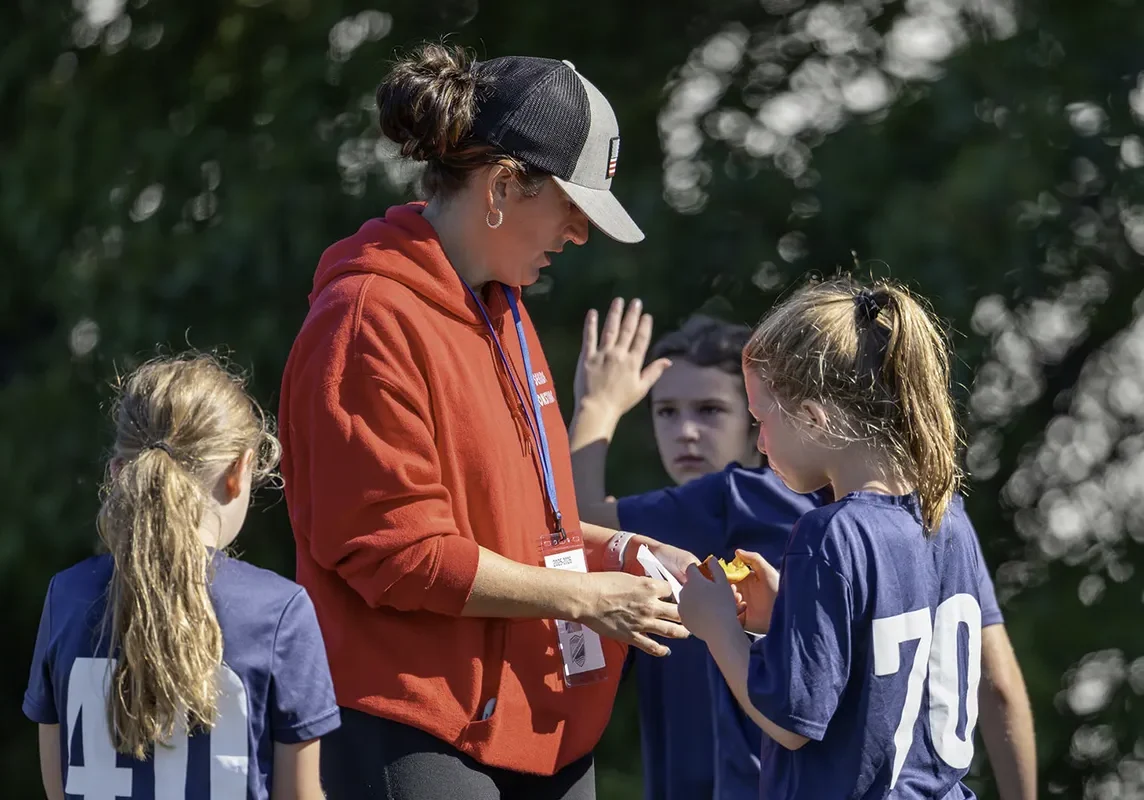 Coach and players high-fiving